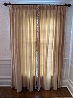 Full view of four drape panels hung on rod showing length, color, and pleats
