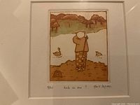 Framed colored lithograph showing a cartoon-style golfer at a pond with ducks, numbered and signed by the artist with pencil markings at bottom.