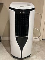 Front view of Gree portable air conditioner, white/black finish