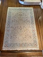 Full view of rug laid on hardwood floor