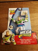 Front view of new Buzz Lightyear Mega Action figure on original card with Toy Story branding and Mattel logo.