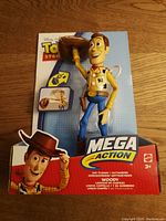 Front view of new on card Toy Story Mega Action Woody figure in packaging