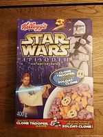Front of the Kellogg's Star Wars Episode II cereal box showing Clone Trooper, Obi-Wan Kenobi, and the cereal contents with Clone Trooper cookies.