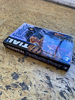 Front cover of the Essential Fantastic Four Volume 4 comic book showing title and artwork.