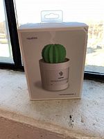 Box of new Qushini cactus humidifier showing product image and packaging.