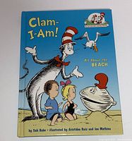 Front cover of the book showing the title 'Clam-I-Am! All About the Beach' with the Cat in the Hat character, clam, and two children on a sandy beach.