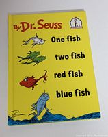 Cover of 'One Fish Two Fish Red Fish Blue Fish' by Dr. Seuss with colorful fish illustrations on yellow background.