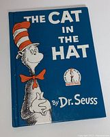 Front cover of The Cat in the Hat by Dr. Seuss showing blue cover with title and Cat in the Hat character in red and white striped hat.