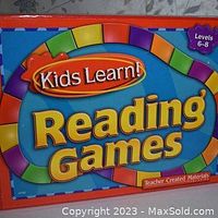 Photo of the front of the box for the Kids Learn! Reading Games Kit showing the colorful game board and grade levels 6-8