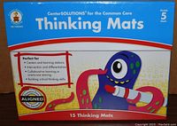 Front of the box showing brand, age level, and key features of the Thinking Mats for Grade 5.