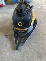 Front view of the Stinger wet/dry vacuum cleaner showing the hose ends and brand label.