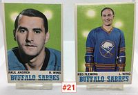 Two Buffalo Sabres hockey cards displayed side by side showing Paul Andrea and Reg Fleming, with a green background and blue team name text.
