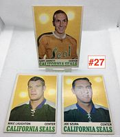 Photo of three hockey cards featuring Gary Jarrett, Mike Laughton and Joe Szura from California Seals 1969-1970 with label #27.