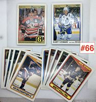 Two hockey cards displayed side by side: one of a Chicago Blackhawks player Courtnall and one of Gary Leeman of Toronto Maple Leafs from O-Pee-Chee 1992 series. Several other cards partially visible underneath.