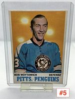 Front of Bob Woytowich hockey card showing player in Penguins blue jersey with clear legible text.