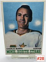 Front of Charlie Burns hockey card showing bright portrait photo in North Stars jersey.