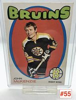 Front side of John McKenzie Boston Bruins 1970-71 hockey card showing player image and team branding.