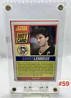 Back view of card with player bio, stats, and Score Hot Card branding visible in protective case.