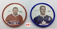 Photo of both hockey coins, showing Gump Worsley in Canadiens uniform and Tim Horton in Maple Leafs uniform with coin rims in red and blue respectively.