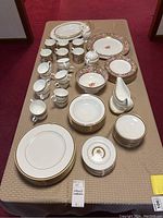Overview of entire 72-piece Wedgwood Clio set on table