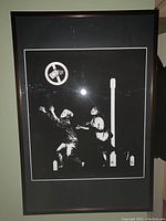 Full view of framed black and white stencil art print featuring two children and a no spray paint logo.