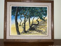 Framed oil painting on canvas showing a beach view in Cuba with trees and signed by Fred Amalfi.