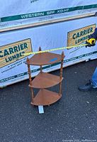 Photo of wooden quarter shelf unit showing full view on pavement with Carrier Lumber background