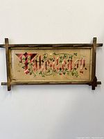 Front view of entire framed sampler showing text and frame style