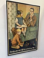 Framed WW1 British War propaganda poster showing main image with seated father and children, featuring the text at the bottom.