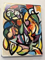 Front view of the abstract oil painting showing vibrant colors and bold black lines.