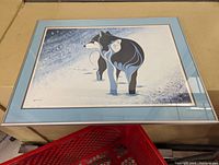 Framed Alpha Wolf art print showing the entire framed piece with clear view of the art and frame condition.