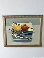 Frontal image of the framed oil painting depicting pear and apple still life with A. Gifford signature.