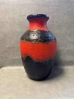 Front view of the large SCHEURICH lava glaze vase showing its red and black textured finish and shape.