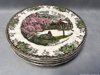 Stack of 5 Johnson Bros Friendly Village dinner plates showing top plate design and edges