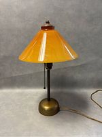 Full front view of assembled lamp showing shade, shaft and base