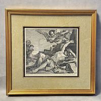 Framed etching depicting a reclining hermit on a rock with an angel hovering above, in a gold frame with beige mat.