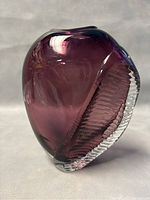 Photo of the vintage Shirley Elford blown art glass vase showing the deep purple smooth glass surface with clear ridged textured glass accent.