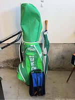 Full view of golf bag, golf umbrella, and shoe bag.