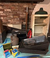 Overview of the metal storage items including the cabinet, pans, bread box, pitcher, file box, and small boxed items.