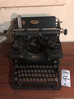 Vintage Royal manual typewriter front view showing full keyboard and paper.