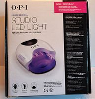 Box packaging of OPI Professional Studio LED Light showing front branding and features
