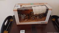 Front view of original boxed Schleich 42024 horse and wagon model, showing the details, scale, and packaging condition.