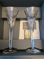 Pair of Waterford crystal champagne flutes in original box with booklet and packing