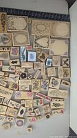Overall view of the variety of different sized rubber stamps with floral and frame designs