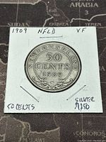 Front side of 1909 Newfoundland 50 cents silver coin showing denomination and year.