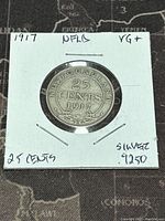 Reverse side of the 1917 Newfoundland 25 cents silver coin with denomination, year, and decorative elements.