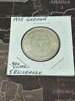 Obverse side of the coin showing the German eagle, 'Deutsches Reich 1935' and '5 Reichsmark' inscription.