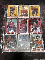 Nine vintage hockey cards featuring Montreal Canadiens players in a transparent plastic sleeve sheet.