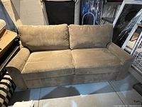 Front view of full sofa showing overall design and condition