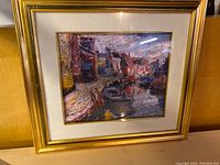 Full view of framed painting showing harbor scene